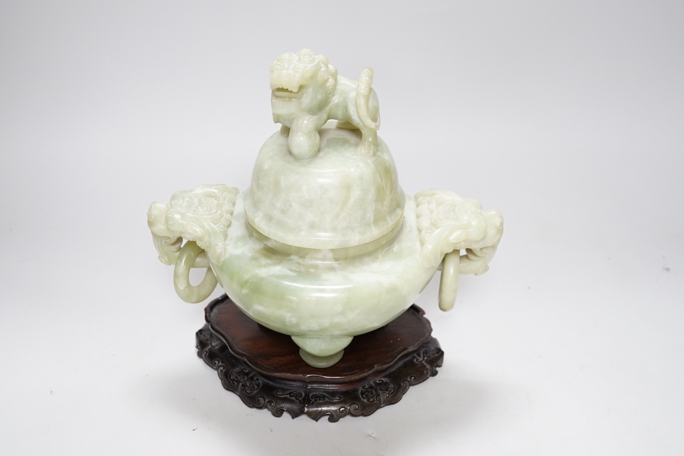 A large Chinese bowenite jade censer and cover on carved hardwood stand, 21cm wide